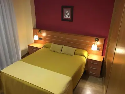 Cama o camas de una habitación en Hostal Doña Juana