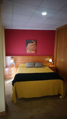 Cama o camas de una habitación en Hostal Doña Juana