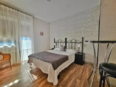 Cama o camas de una habitación en Hostal Mainz