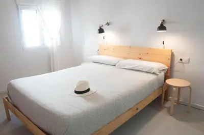 Cama o camas de una habitación en Apartamentos de la Parte Antigua de Cáceres