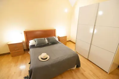 Cama o camas de una habitación en Apartamentos de la Parte Antigua de Cáceres