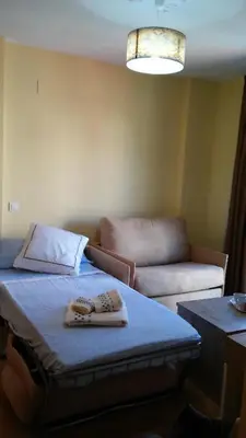 Cama o camas de una habitación en Apartamentos Turísticos La Garza