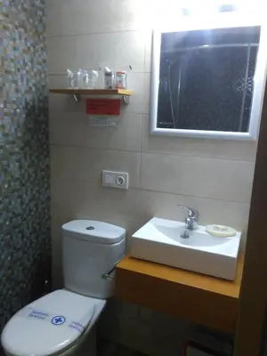 Un baño de Apartamentos Turísticos La Garza