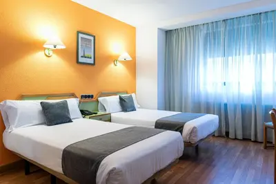 Cama o camas de una habitación en Hotel Alda Guijuelo