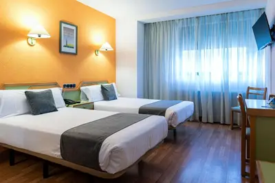 Cama o camas de una habitación en Hotel Alda Guijuelo