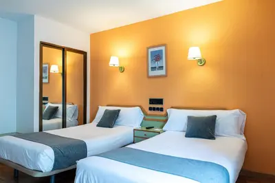 Cama o camas de una habitación en Hotel Alda Guijuelo