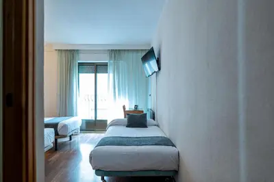 Cama o camas de una habitación en Hotel Alda Guijuelo