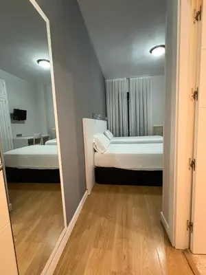 Cama o camas de una habitación en Hotel Amefa