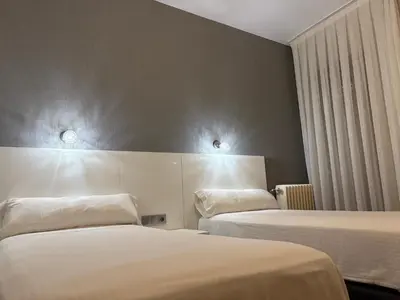Cama o camas de una habitación en Hotel Amefa