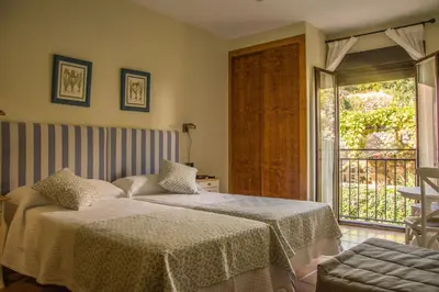 Cama o camas de una habitación en Casa Rural Fuente El Boticario
