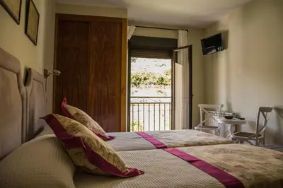 Cama o camas de una habitación en Casa Rural Fuente El Boticario