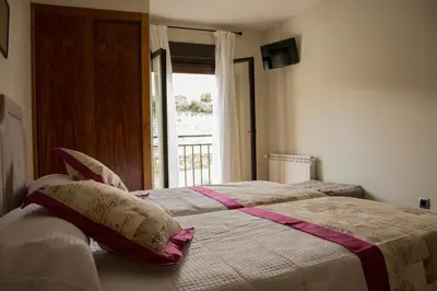Cama o camas de una habitación en Casa Rural Fuente El Boticario