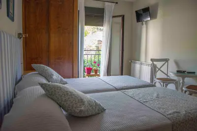 Cama o camas de una habitación en Casa Rural Fuente El Boticario