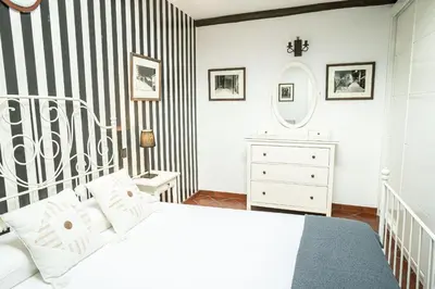 Cama o camas de una habitación en Versatil Apartamentos
