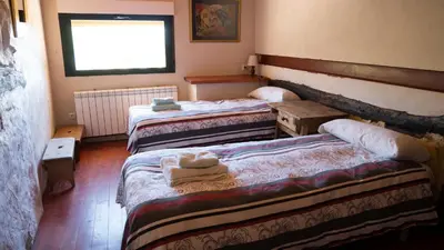 Cama o camas de una habitación en Casas Rurales Lalo y Chelo