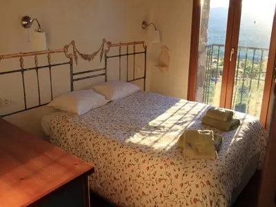 Cama o camas de una habitación en Casas Rurales Lalo y Chelo