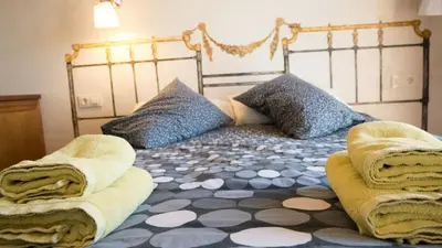 Cama o camas de una habitación en Casas Rurales Lalo y Chelo