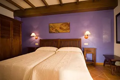 Cama o camas de una habitación en Apartamentos Rurales Cumbres de Gredos
