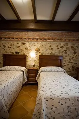 Cama o camas de una habitación en Apartamentos Rurales Cumbres de Gredos