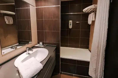 Un baño de Zenit Aparthotel Hall 88