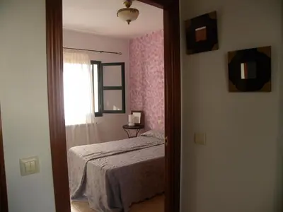 Cama o camas de una habitación en El Jardin de los Gatos Apartament