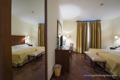 Cama o camas de una habitación en Hospedium Hotel Cortijo Santa Cruz