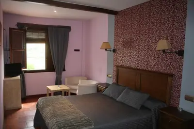 Cama o camas de una habitación en Hotel Rural Carlos I