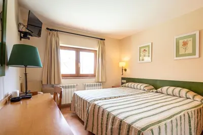 Cama o camas de una habitación en Hotel Galayos