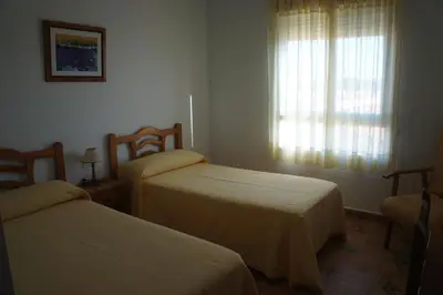 Cama o camas de una habitación en Hotel Apartamentos Kantara Al-Saif