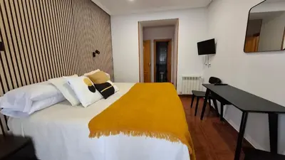 Cama o camas de una habitación en Hostal Bellas