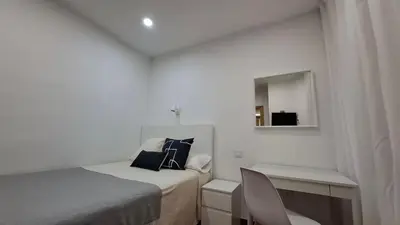 Cama o camas de una habitación en Hostal Bellas