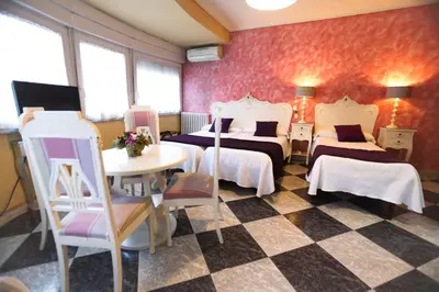 Cama o camas de una habitación en Hostal Goya Suites