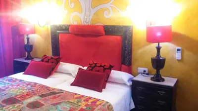Cama o camas de una habitación en Hostal Goya Suites