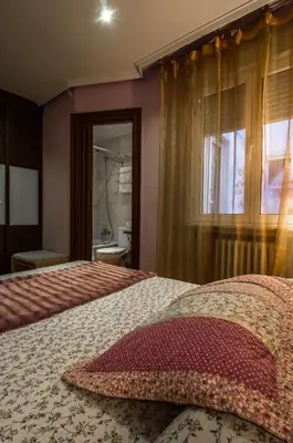 Cama o camas de una habitación en Hostal Goya Suites