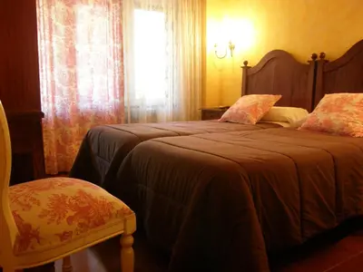 Cama o camas de una habitación en Hostal Goya Suites