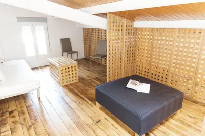 Cama o camas de una habitación en PINTORES ROOMS Apartamentos Turísticos
