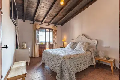 Cama o camas de una habitación en Natural&Mente El Tomillar