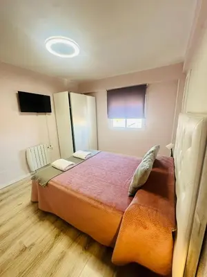 Cama o camas de una habitación en Imperium Apartamentos Centro Parking Gratis