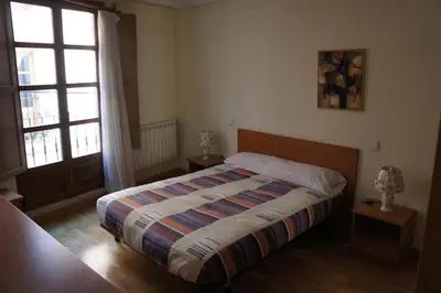 Cama o camas de una habitación en Monumental Apartments Salamanca