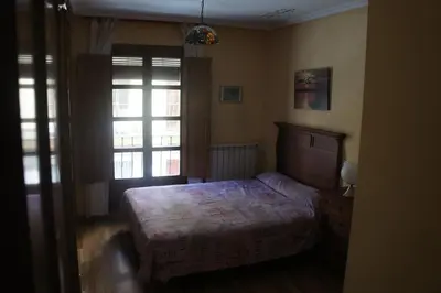 Cama o camas de una habitación en Monumental Apartments Salamanca