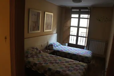 Cama o camas de una habitación en Monumental Apartments Salamanca