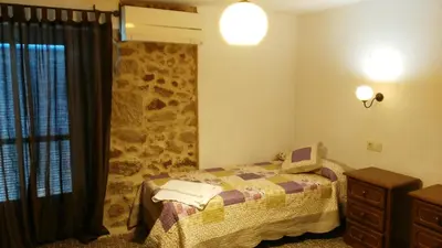 Cama o camas de una habitación en Apartamento o Casa Rural Roquemar