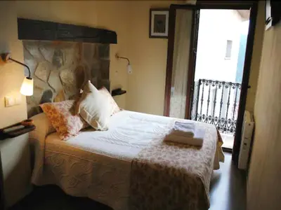 Cama o camas de una habitación en Hospedería Tía María