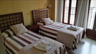 Cama o camas de una habitación en Hospedería Tía María