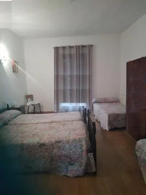Cama o camas de una habitación en Pension Carretero
