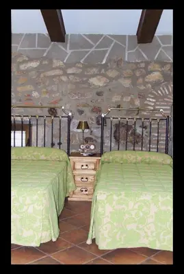 Cama o camas de una habitación en Casa Rural La Chimenea