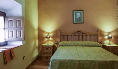 Cama o camas de una habitación en Casa Rural La Chimenea