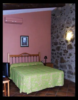 Cama o camas de una habitación en Casa Rural La Chimenea