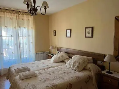 Cama o camas de una habitación en El Sobrao de Gredos