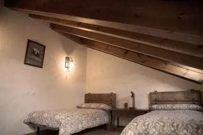 Cama o camas de una habitación en La Casona del Tormes